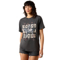 Woman wearing a dark gray t-shirt with 'BODEO' text and graphics on a white background