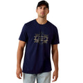 Man wearing a navy blue Ariat t-shirt on a white background