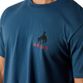 Blue t-shirt with Ariat logo on a white background