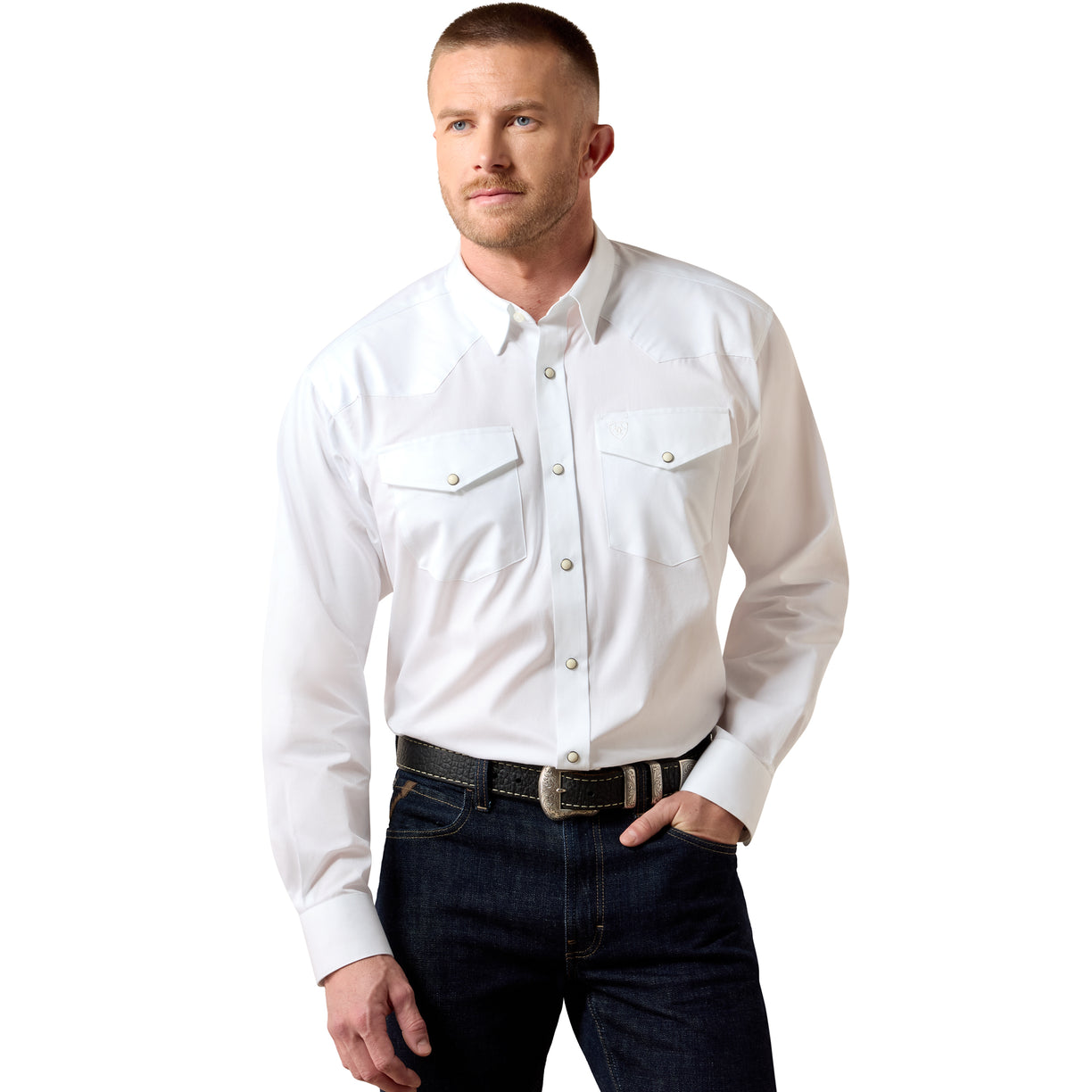 Man wearing a white shirt and dark jeans on a white background
