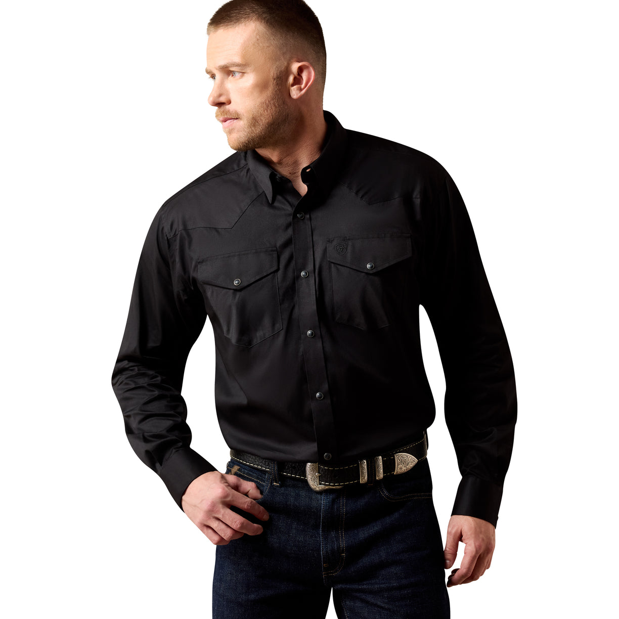 Man wearing a black shirt and jeans on a white background