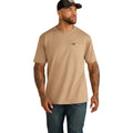 Tan pocket t-shirt paired with dark denim jeans and a cap
