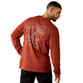 Man wearing a rust-brown long sleeve tee with a vintage American Workwear badge graphic on the back