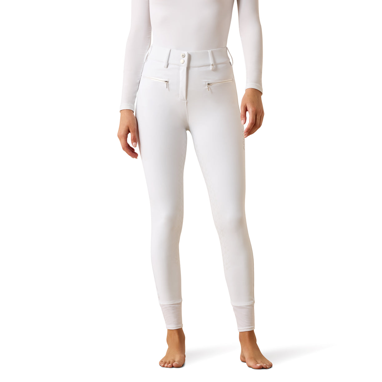 Close-fitting white riding breeches with zip pockets and full-seat silicone grip - the Ariat Tri Factor Allure Full Seat Breech, styled with a white base layer
