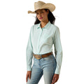 Woman wearing a light blue striped shirt, jeans, and a cowboy hat on a white background