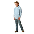 Child wearing a light blue hoodie and jeans on a white background