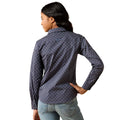 A woman shown from the back wearing a dark gray long-sleeve button-down shirt with a small white polka dot pattern, paired with light blue jeans, against a plain white background.