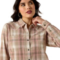 Woman wearing a plaid shirt on a white background