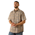 Man wearing a brown and beige plaid work shirt with dual chest pockets