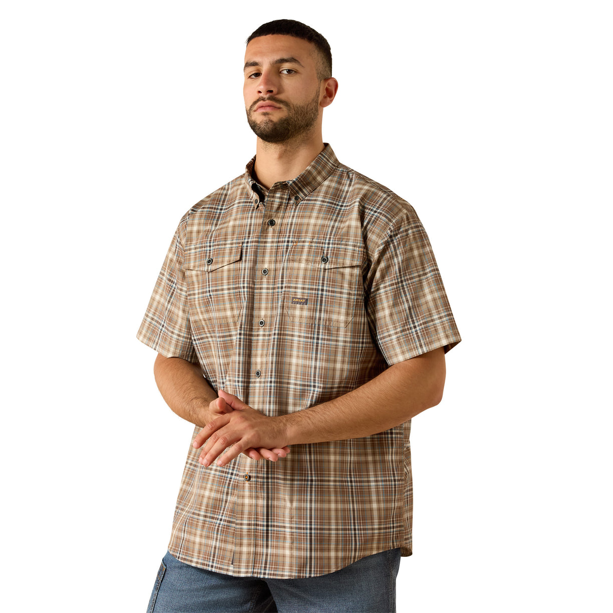 Man wearing a brown and beige plaid work shirt with dual chest pockets