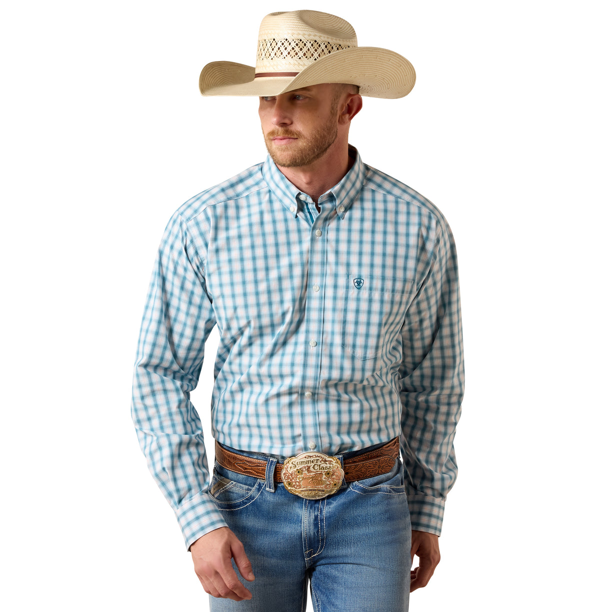 A man wearing a light blue and white checkered western long-sleeve shirt, blue jeans, a brown leather belt with a large silver buckle, and a beige cowboy hat, photographed against a solid white background.