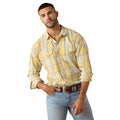 A man wearing a light yellow and white plaid western-style button-down shirt with light blue jeans and a brown belt, photographed against a solid white background.