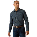 Man wearing a dark denim shirt and jeans on a white background