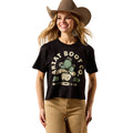 Woman wearing a black t-shirt with 'Artat Boot Co.' logo and a cowboy hat on a white background