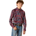 Child wearing a patterned red shirt and jeans on a white background