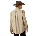 Person wearing a beige shirt and brown hat on a white background