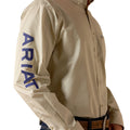 Beige jacket with 'Ariat' branding on a white background