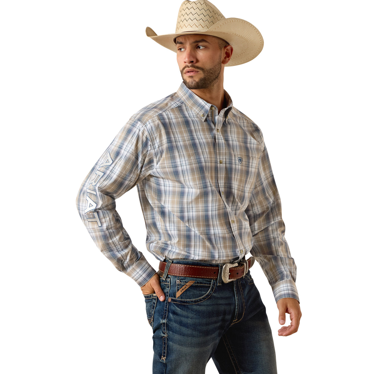 Ariat Pro Series Team Pierre Classic Fit Shirt in a tan and navy plaid, tucked with a leather belt.
