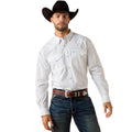 Man wearing a white patterned shirt, dark jeans, and a black cowboy hat on a white background