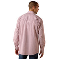 A man viewed from the back wearing a pink and white micro-patterned long-sleeve button-down shirt, paired with blue jeans, against a plain white background.