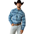 A man wearing a blue and white striped western long-sleeve button-down shirt, a black cowboy hat, and light gray jeans, standing against a plain white background.