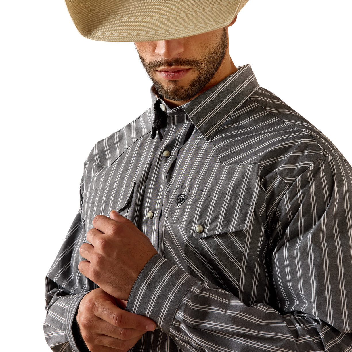 A man wearing a gray and white vertically striped western long-sleeve button-down shirt, styled with a beige cowboy hat, shown against a plain white background.