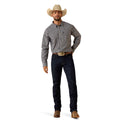 A man modeling a long-sleeve button-down shirt with vertical gray and white stripes, paired with dark blue jeans, a cowboy hat, and brown boots against a plain white background.