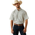Short-sleeve shirt in a geometric weave print, worn with dark denim.