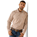 Man wearing a brown checkered shirt with a visible brand logo on a white background
