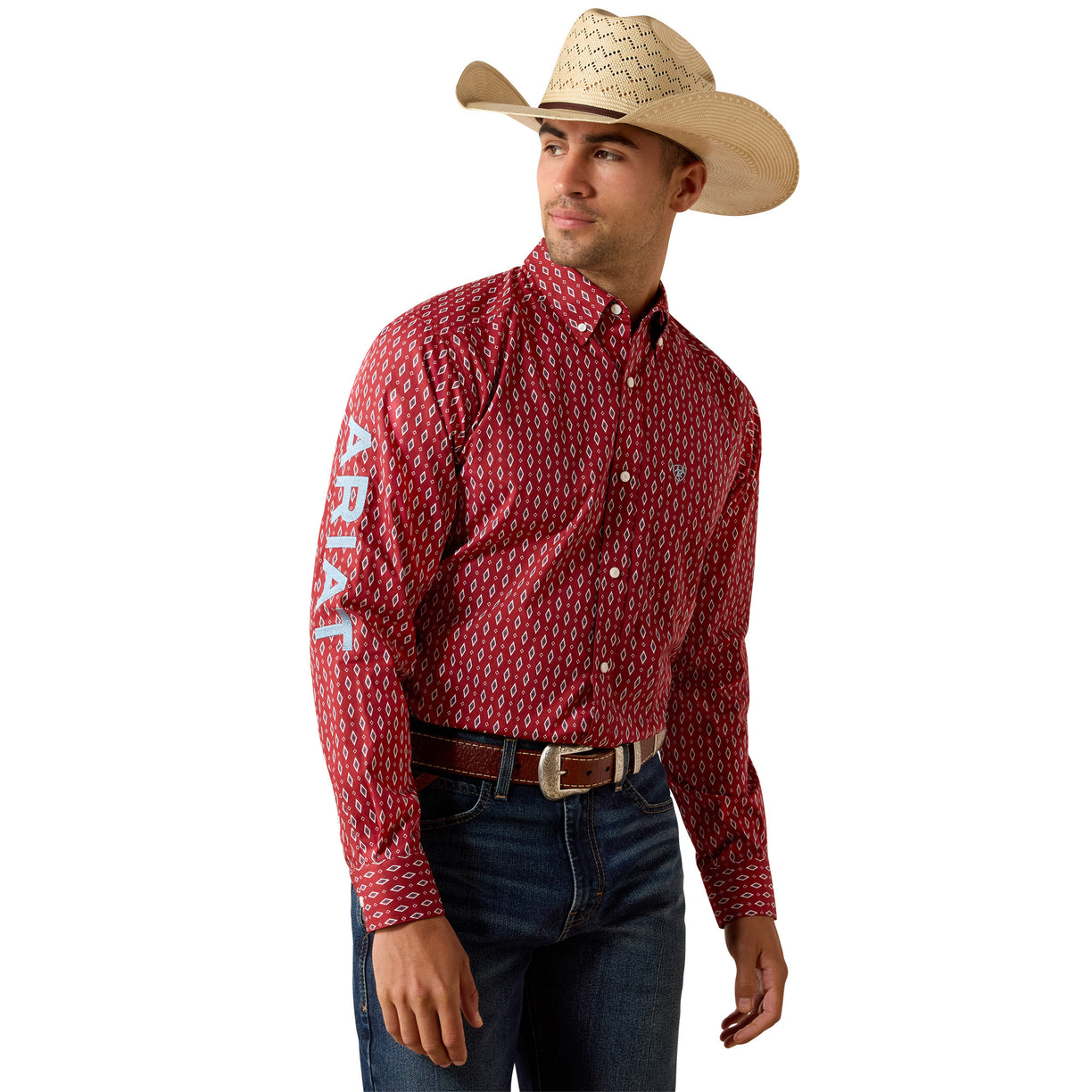 Red diamond-print button-up shirt with an Ariat sleeve logo, paired with jeans and a cowboy hat