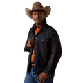 Man wearing a black jacket, orange shirt, and brown cowboy hat on a white background