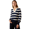 Woman wearing a navy and white striped sweater on a white background