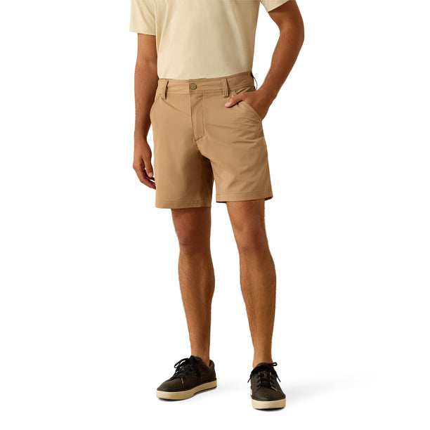 Person wearing beige shorts on a white background