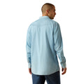 Man wearing a light blue denim shirt on a white background