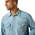 Man wearing a light blue denim shirt on a white background