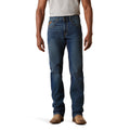 Person wearing blue jeans on a white background