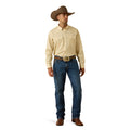 Man wearing a beige shirt, blue jeans, and a brown cowboy hat on a white background