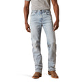 Light blue jeans worn by a person on a white background