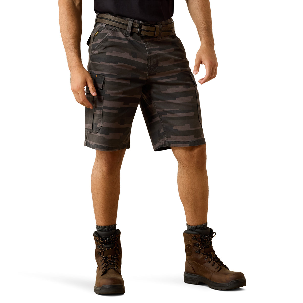 Dark camouflage cargo shorts, paired with brown lace-up boots