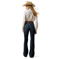 Woman wearing a beige shirt, blue jeans, and a cowboy hat on a white background