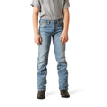 Person wearing light blue jeans on a white background