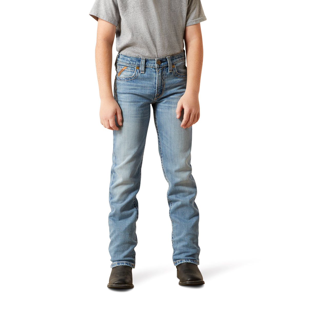 Person wearing light blue jeans on a white background