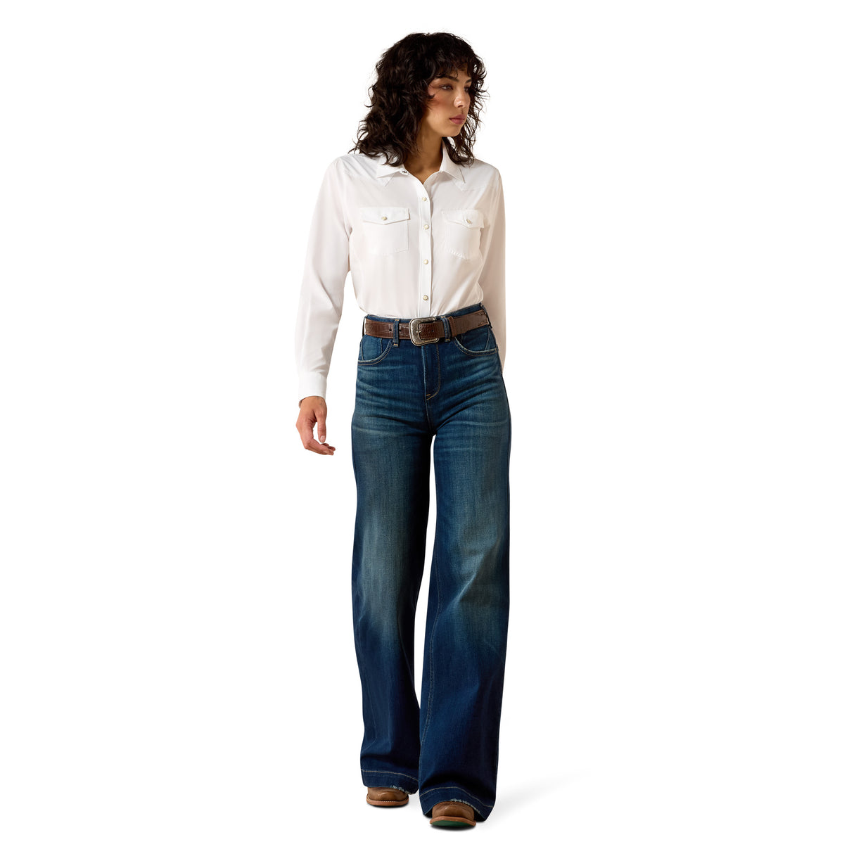 Woman wearing a white shirt and blue jeans on a white background