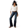 Woman wearing a white shirt, blue jeans, and a black cowboy hat on a white background
