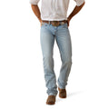 Light blue jeans worn by a person on a white background