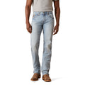 Light blue jeans worn by a person on a white background