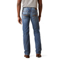 Person wearing blue jeans on a white background