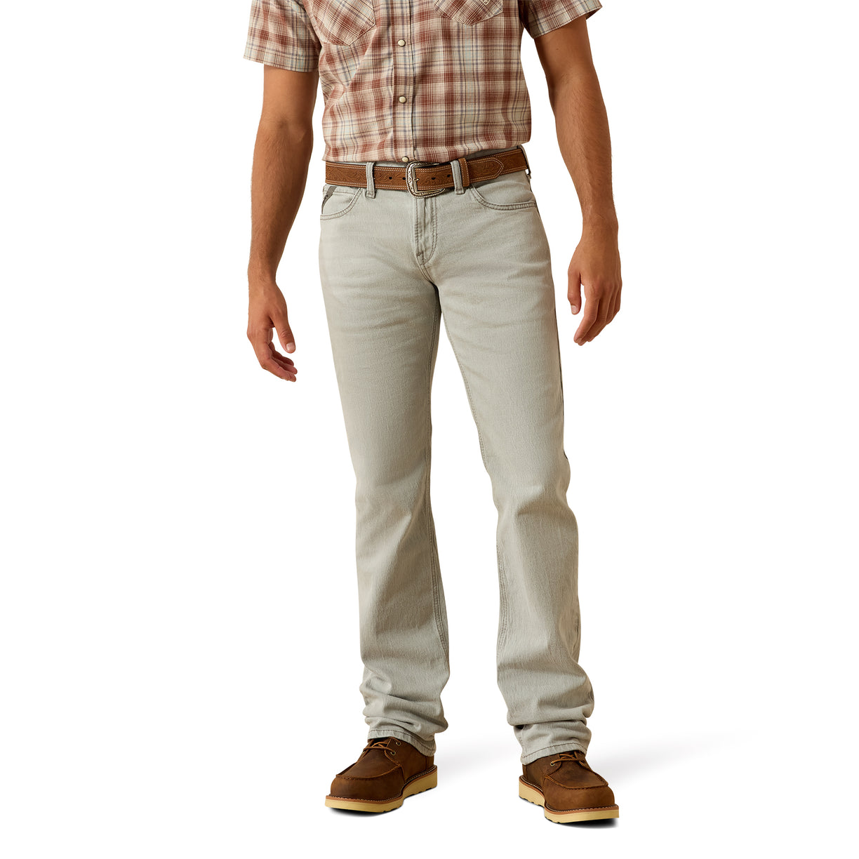 Person wearing light-colored jeans and a plaid shirt on a white background