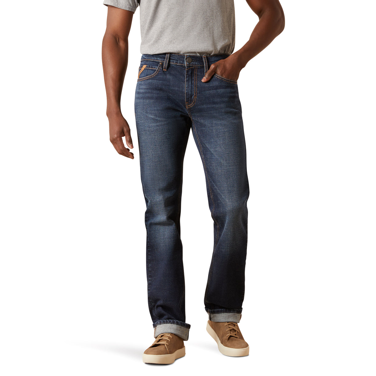 Person wearing blue jeans and a gray shirt on a white background