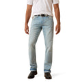 Light blue jeans worn by a person on a white background